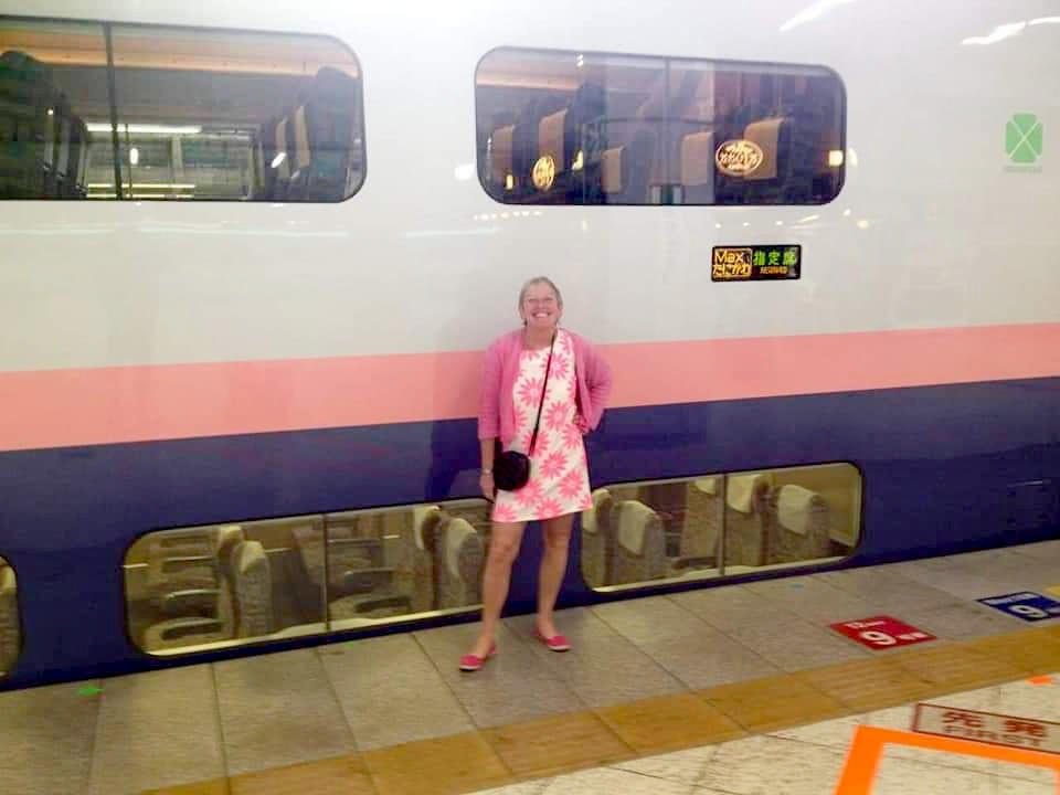 Lynn in front of bullet train