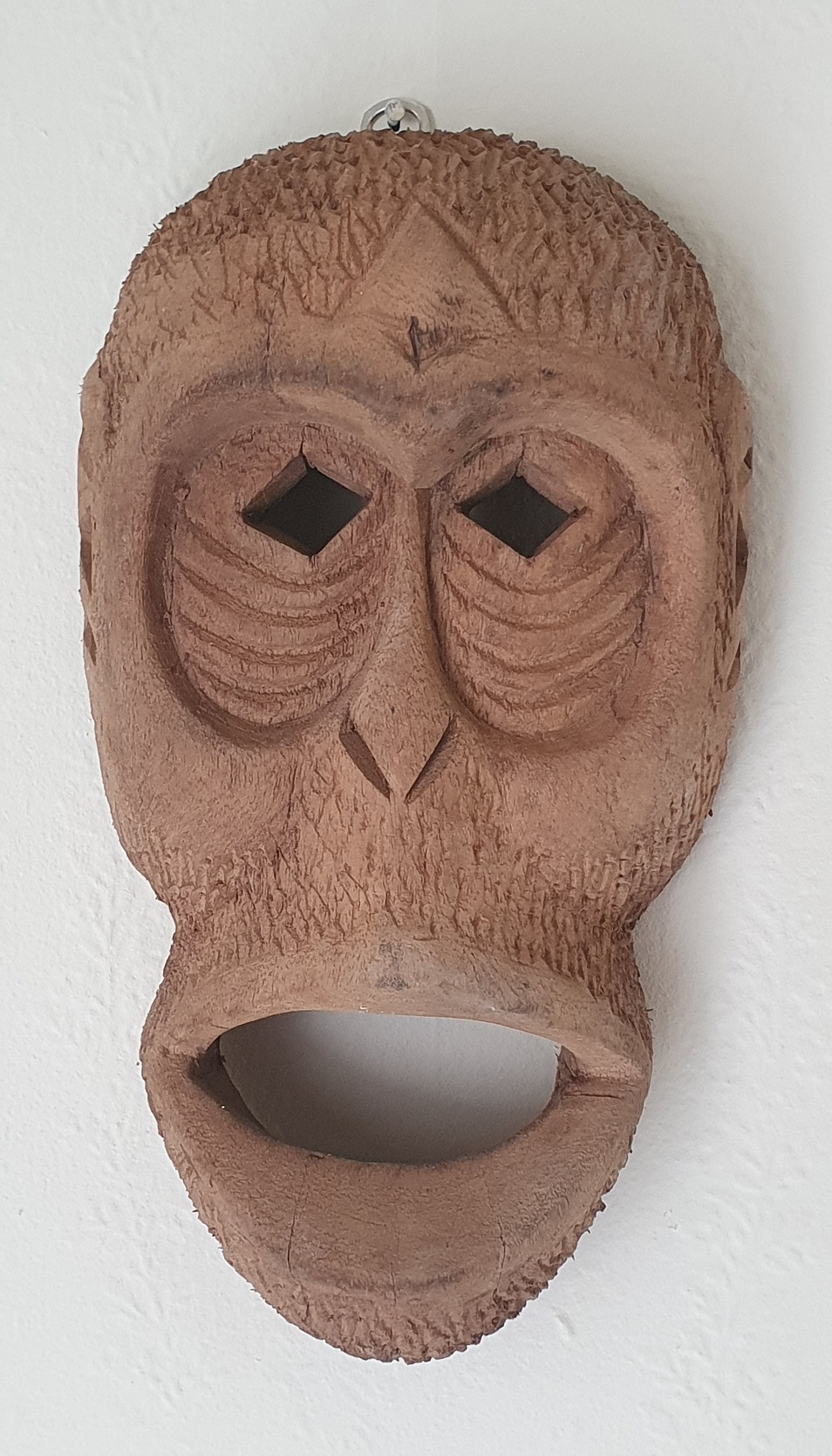 chimpanzee mask from Sierra Leone carved by a man using his feet