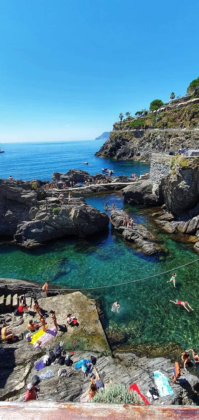 sunbathing on the rocks at monterosso
