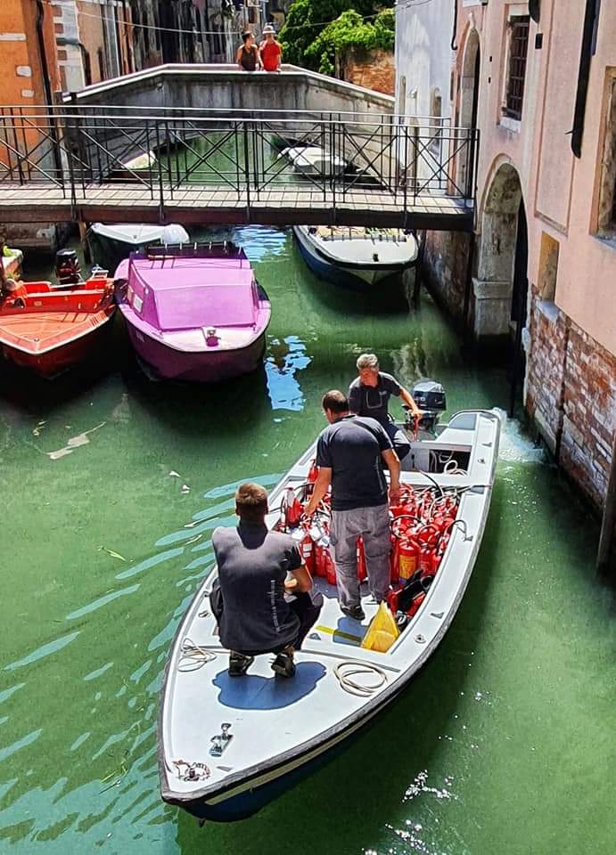 a visit to venice - firemen go by boat