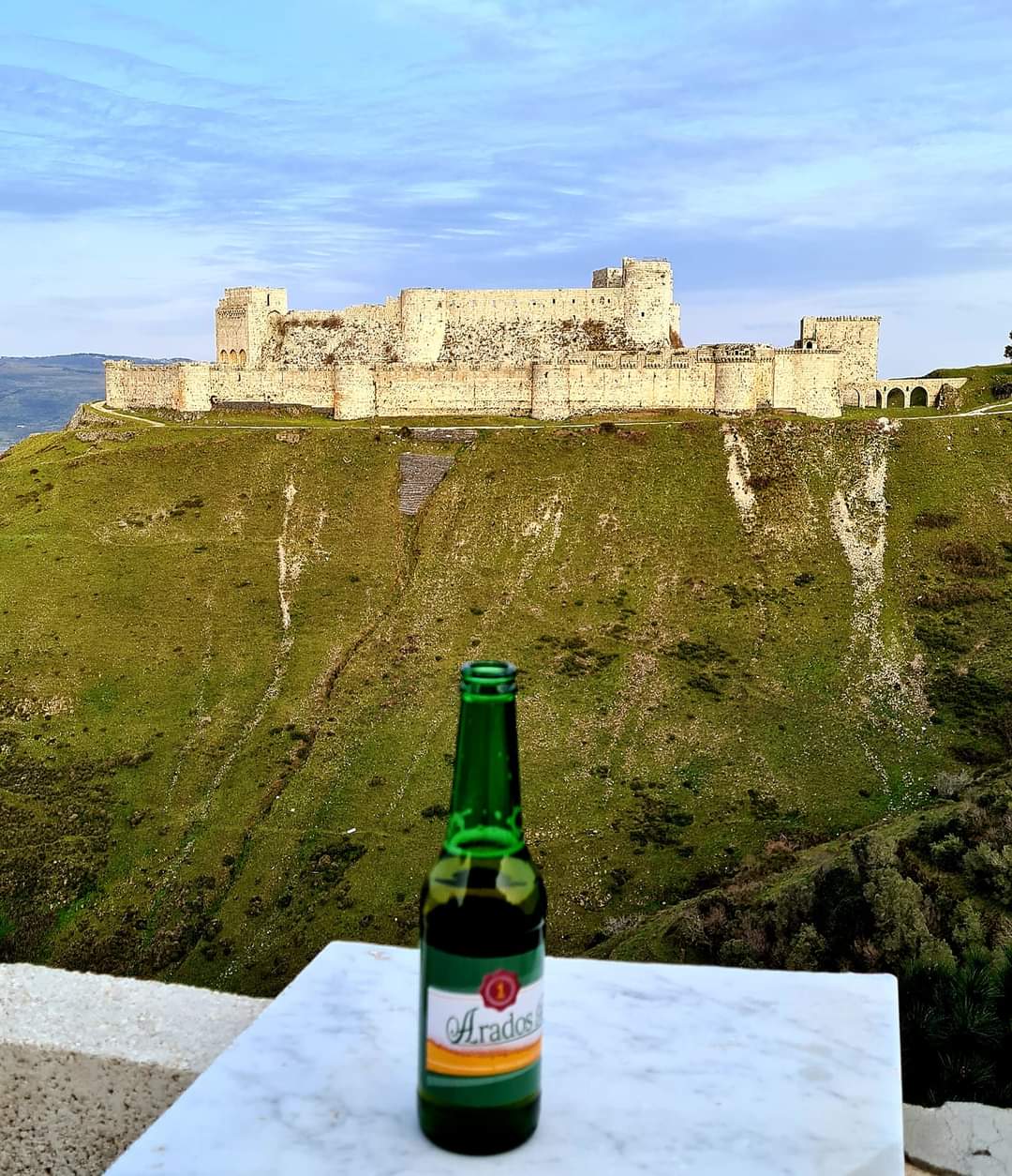 A beer with a view of Krak-des-Chevalier crusader castle
