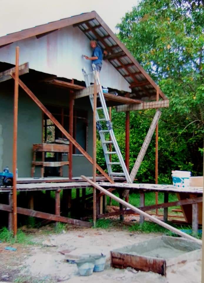Me painting the Orangutan guard post in Borneo