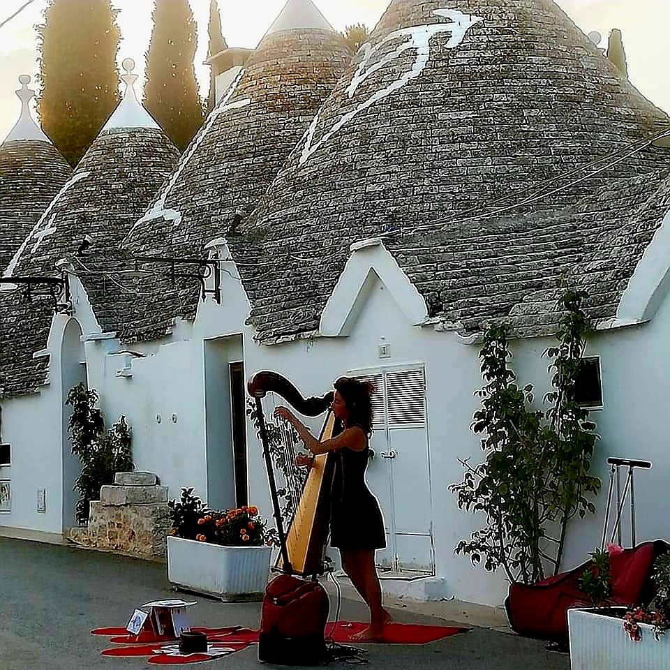 A harpist in Alberobello, Puglia, Italy
