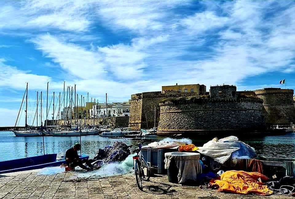 A fisherman mending his nets by the fortress in Gallipoli