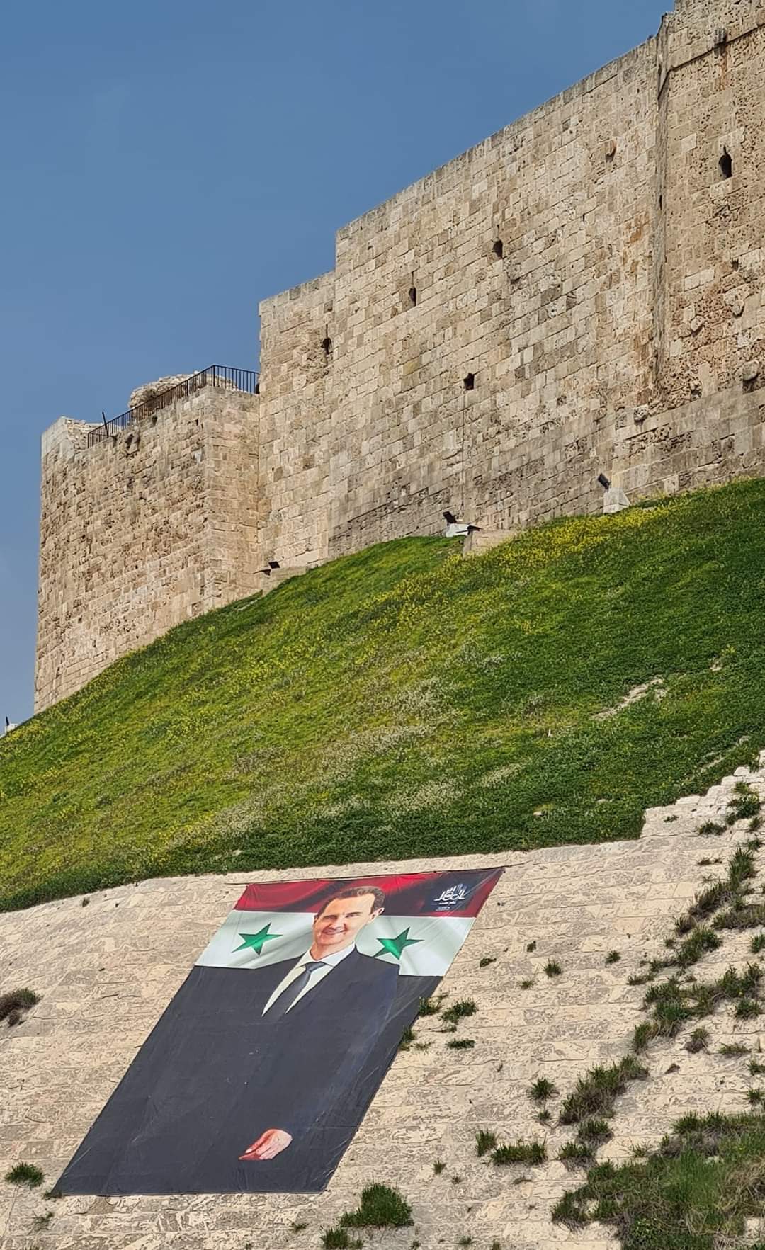A portrait of President Assad outside Aleppo citadel, Syria