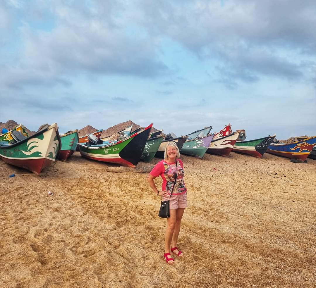 Me with local fishing boats in Socotra