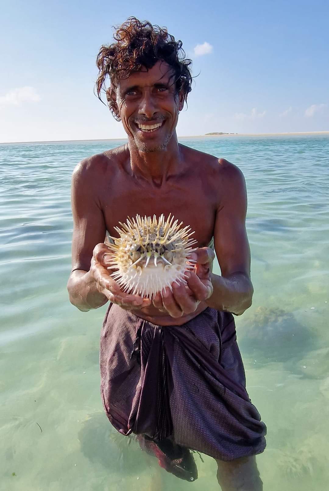 The caveman with a puffer fish in Socotra