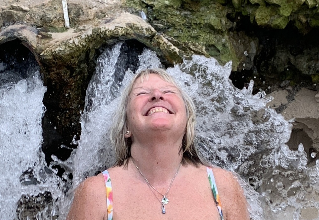 Me under the natural beach shower in Socotra