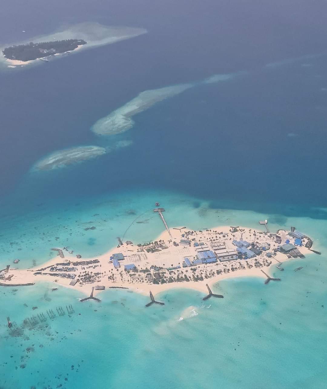 An island in the Maldives seen from the plane