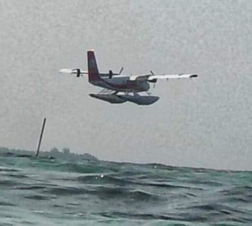 A seaplane landing in the Maldives